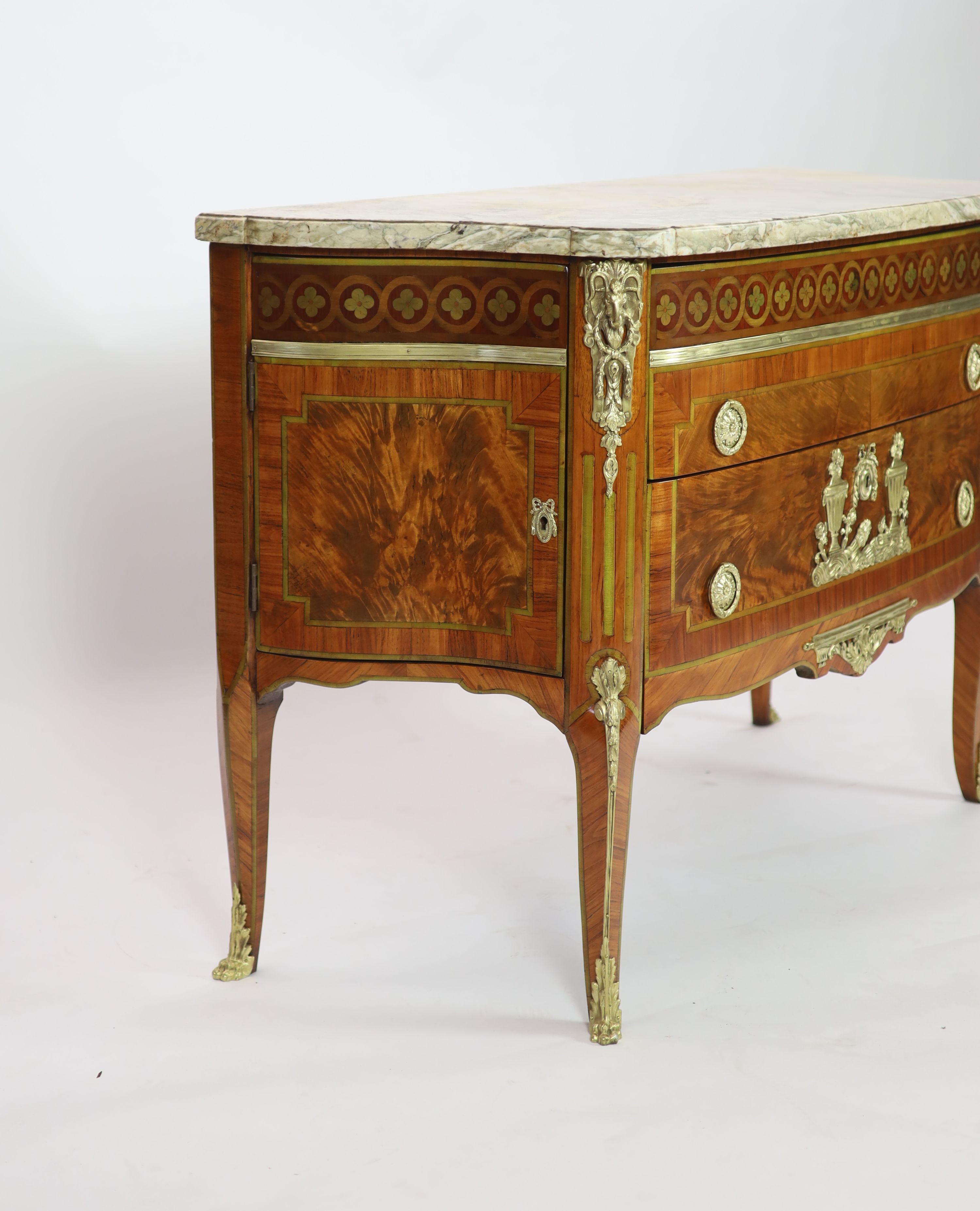 A late 19th century French marquetry and flame mahogany bowfront commode W.131cm D.54cm H.90cm